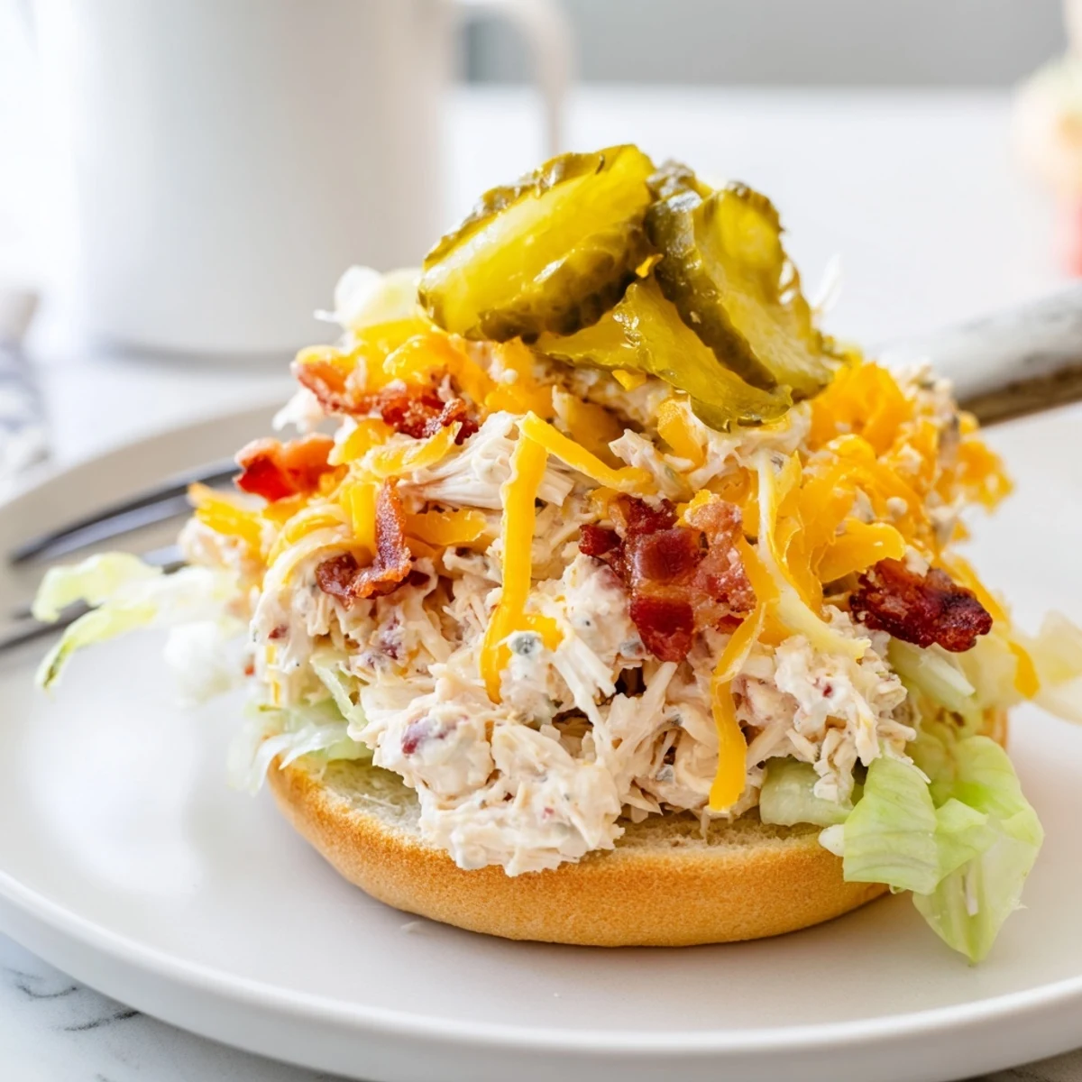 Crack Chicken Sandwiches piled high, creamy cheesy filling and crispy bacon.