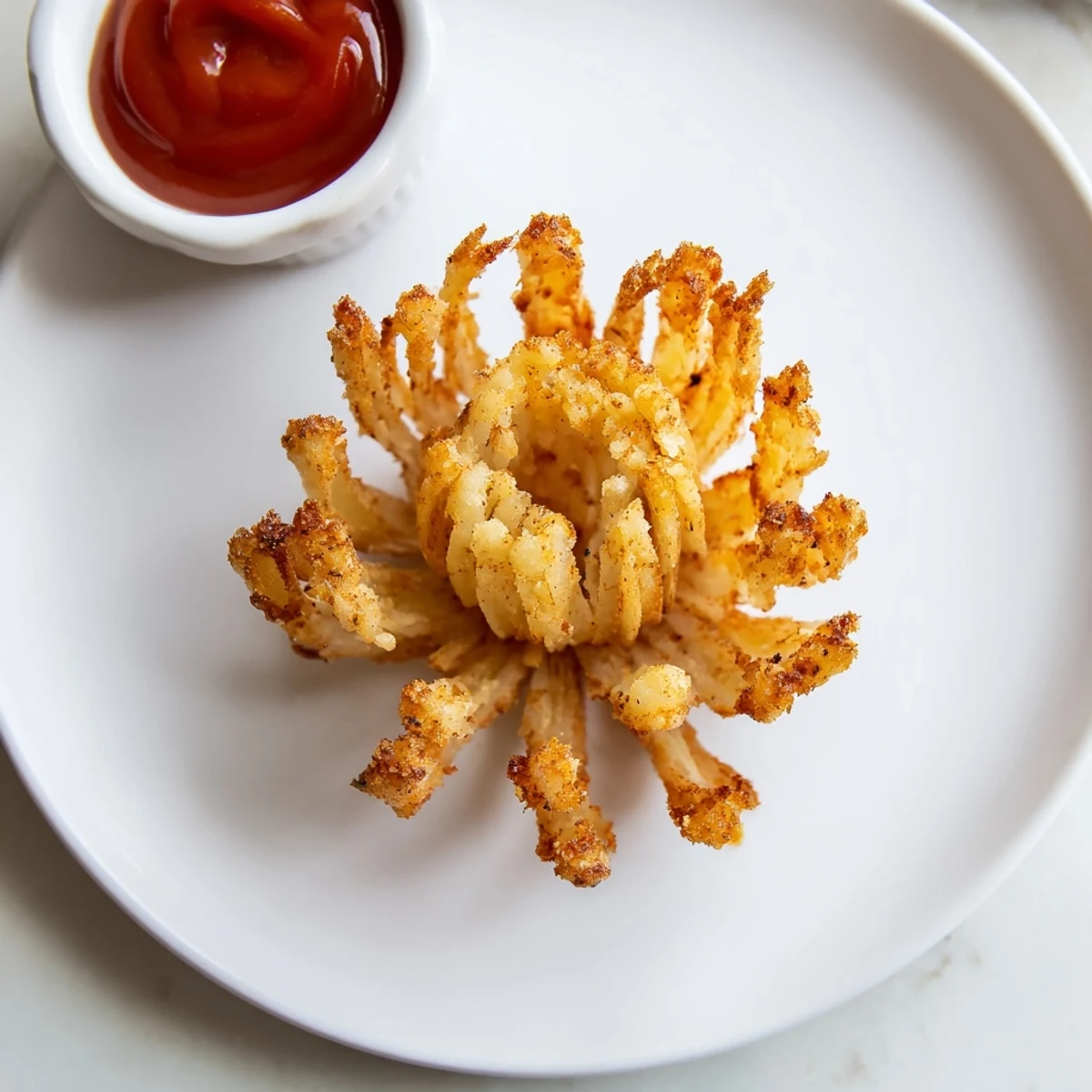 Crispy Mini Bloomin Onions Recipe on a platter, golden petals and dipping sauce