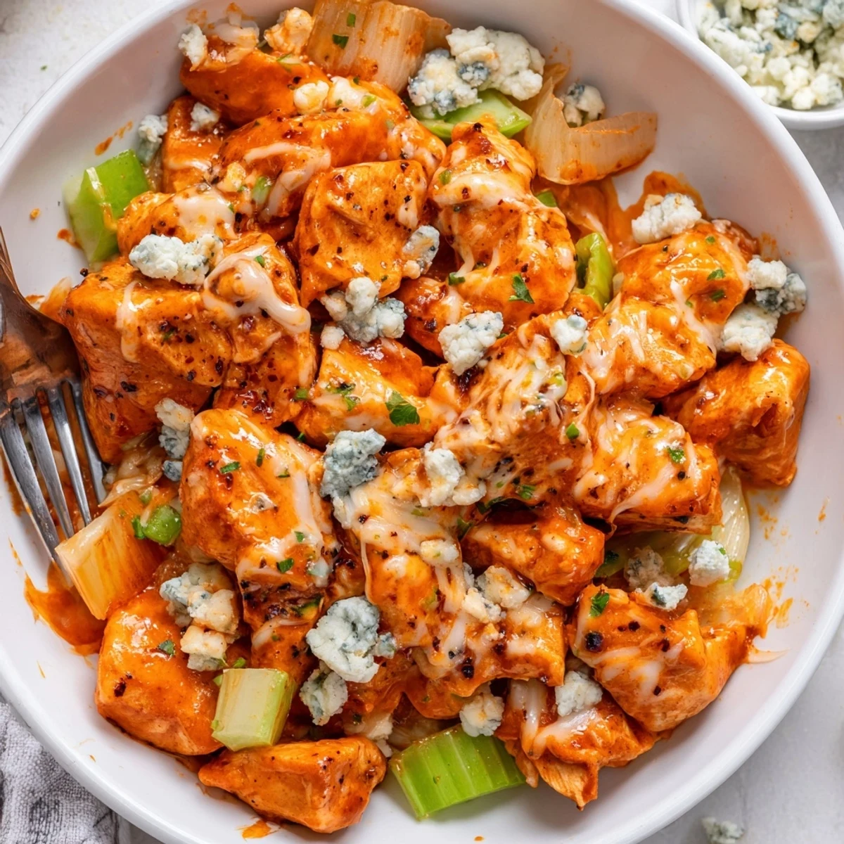 Served over cauliflower rice, Keto Buffalo Chicken Skillet offers spicy, creamy comfort.