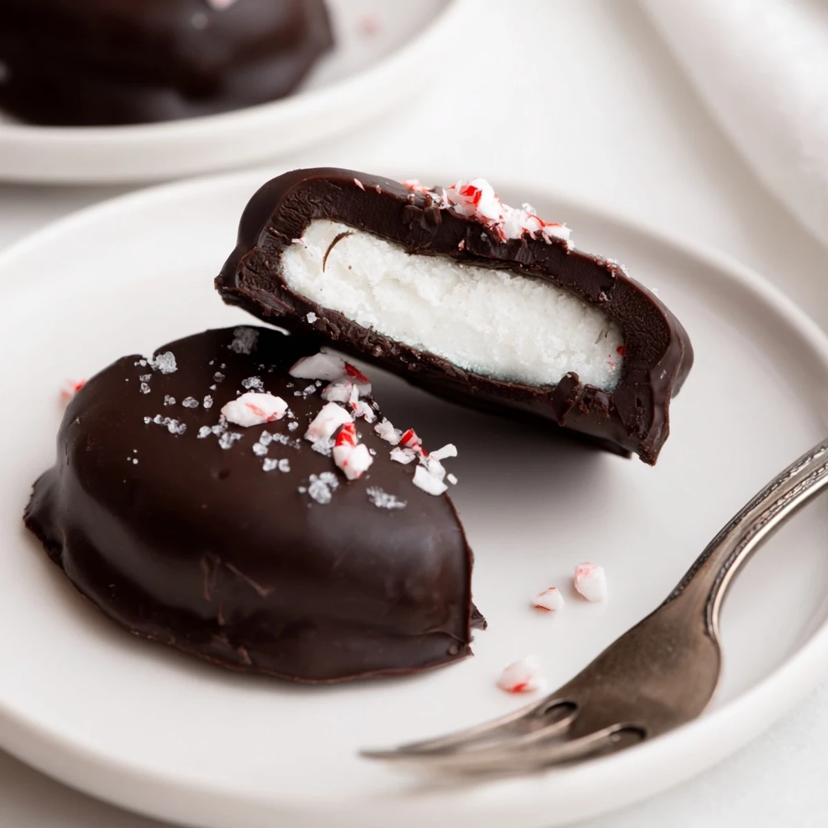 Homemade Peppermint Patties arranged for gifting, dusted with crushed candy