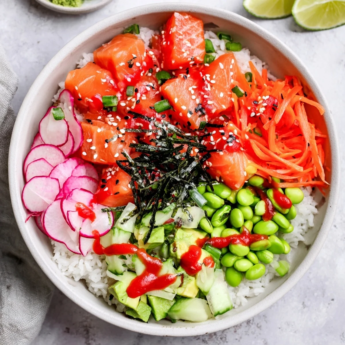 Fresh Hawaiian-style salmon and avocado poke bowl with crisp vegetables over seasoned rice