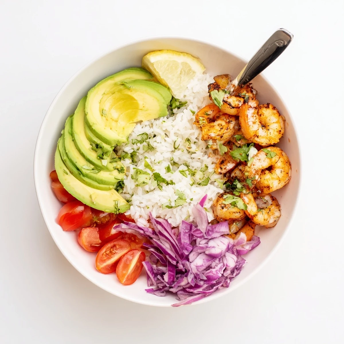 Crunchy cucumber, shredded red cabbage, and avocado topping a Garlic Shrimp Bowl