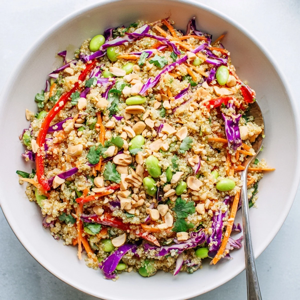Asian Dressing Quinoa Salad with fluffy quinoa, crunchy veggies, tangy sesame-lime dressing.