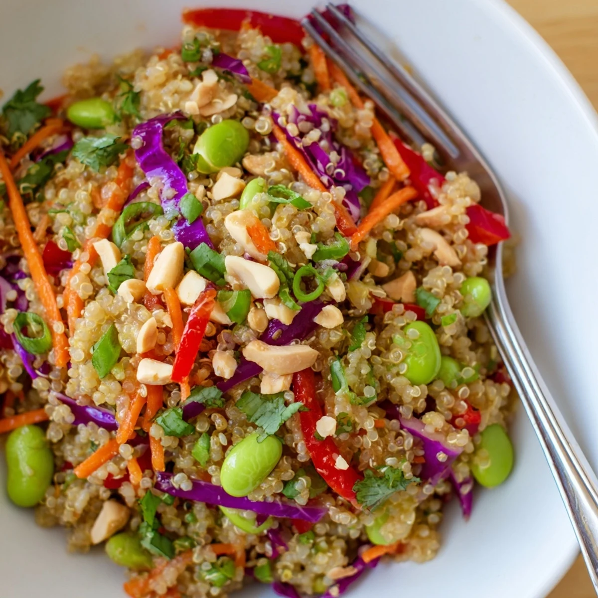 Bright Asian Dressing Quinoa Salad tossed with shredded cabbage, edamame, and cilantro.