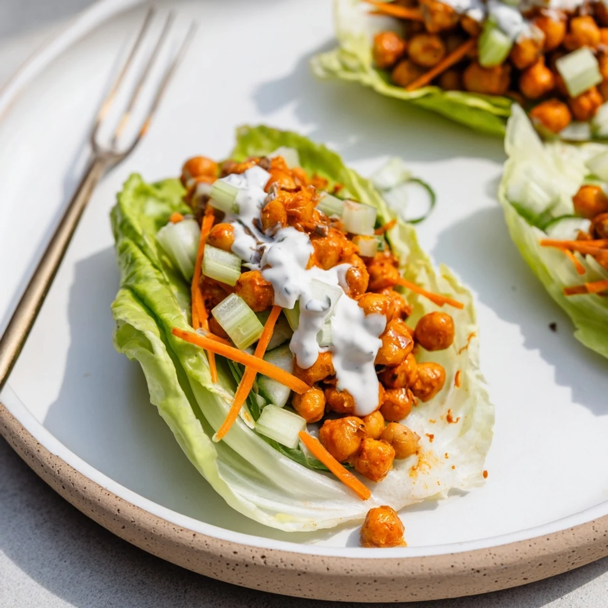Warm Buffalo Chickpea Lettuce Wraps straight from the skillet, tangy and crunchy