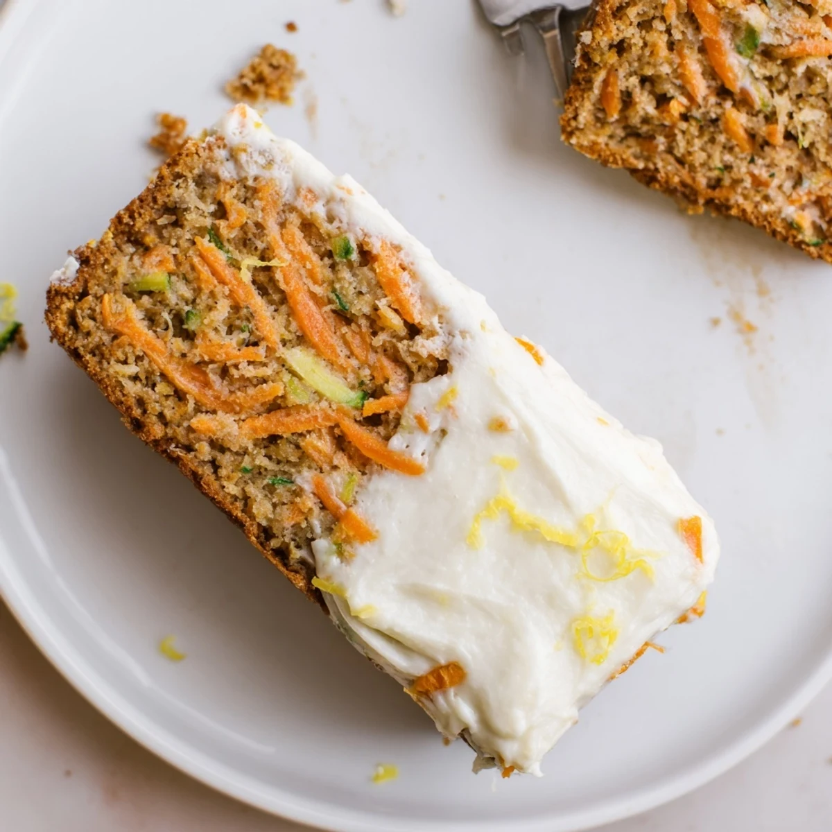 Spiced Ginger Carrot And Zucchini Bars With Lemon Cream Cheese Frosting, sliced for teatime