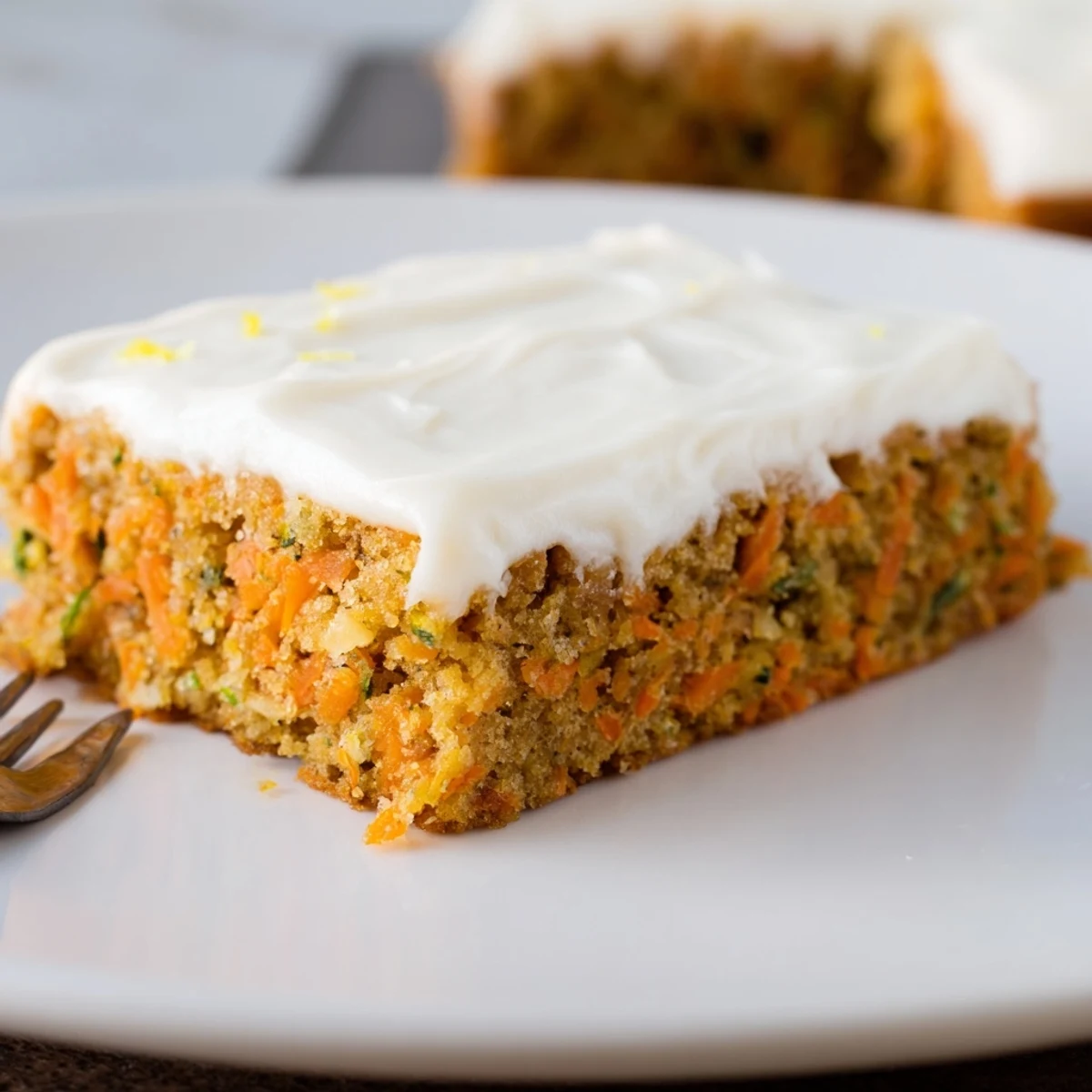 Spiced Ginger Carrot And Zucchini Bars With Lemon Cream Cheese Frosting on cooling rack