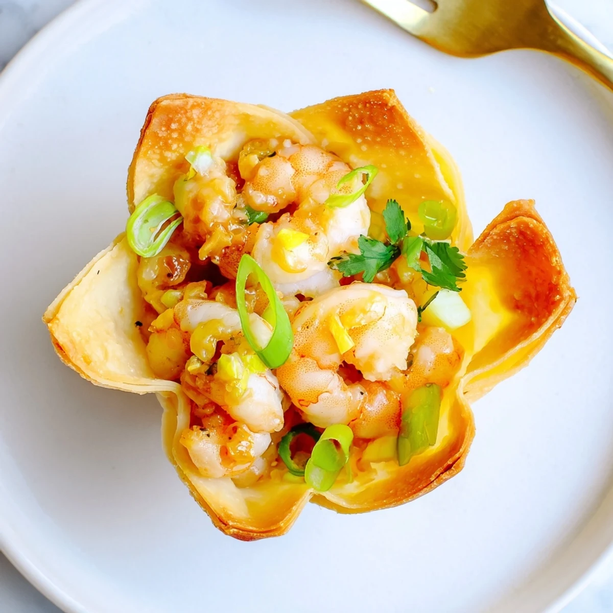 Appetizer ready bites with creamy lime dollop: Crispy Shrimp Wonton Cups With Lime Cream