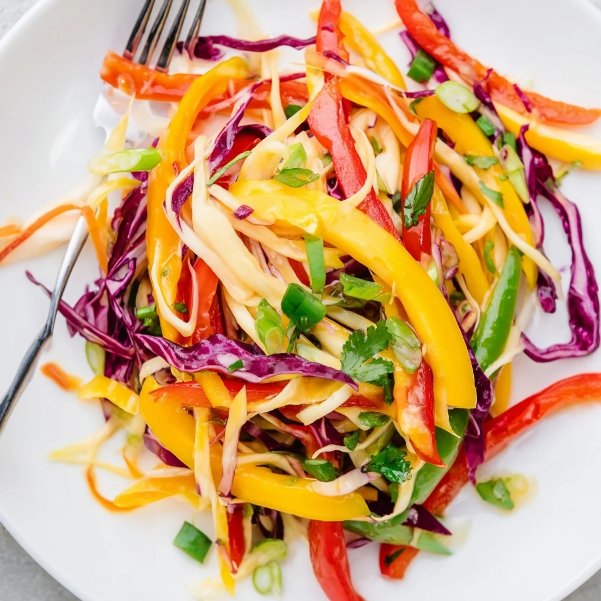Fresh mango slaw topped with cilantro, cashews, and vibrant julienned vegetables