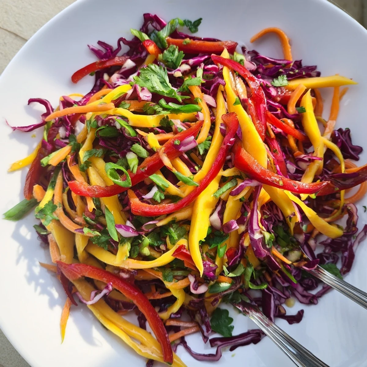 Tropical mango slaw recipe featuring crisp cabbage and sweet lime honey dressing