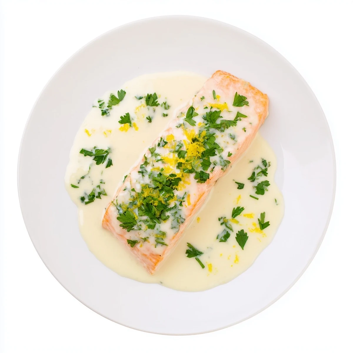 Succulent salmon with lemon cream sauce plated on white dinnerware with zesty garlic butter