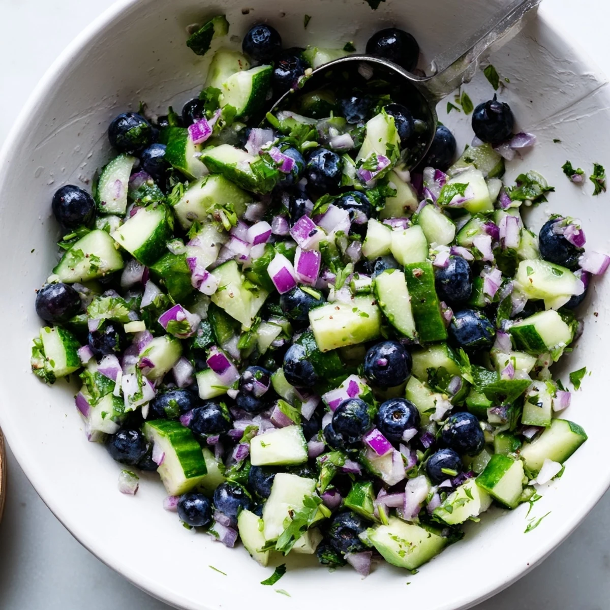 Vibrant blueberry cucumber salsa bursting with juicy berries, crisp veggies, and cilantro