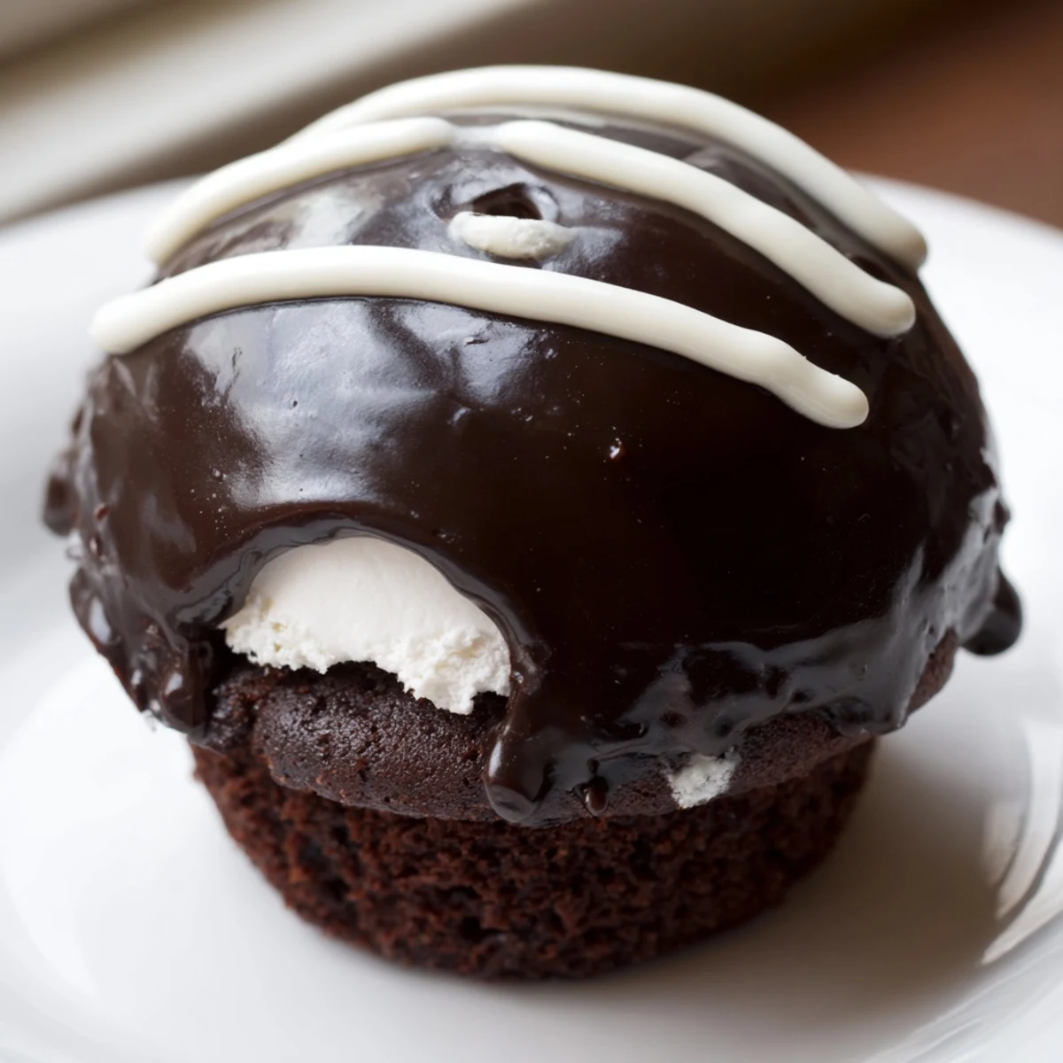 Homemade Hostess Cupcakes crowned with dark ganache and signature white icing swirl