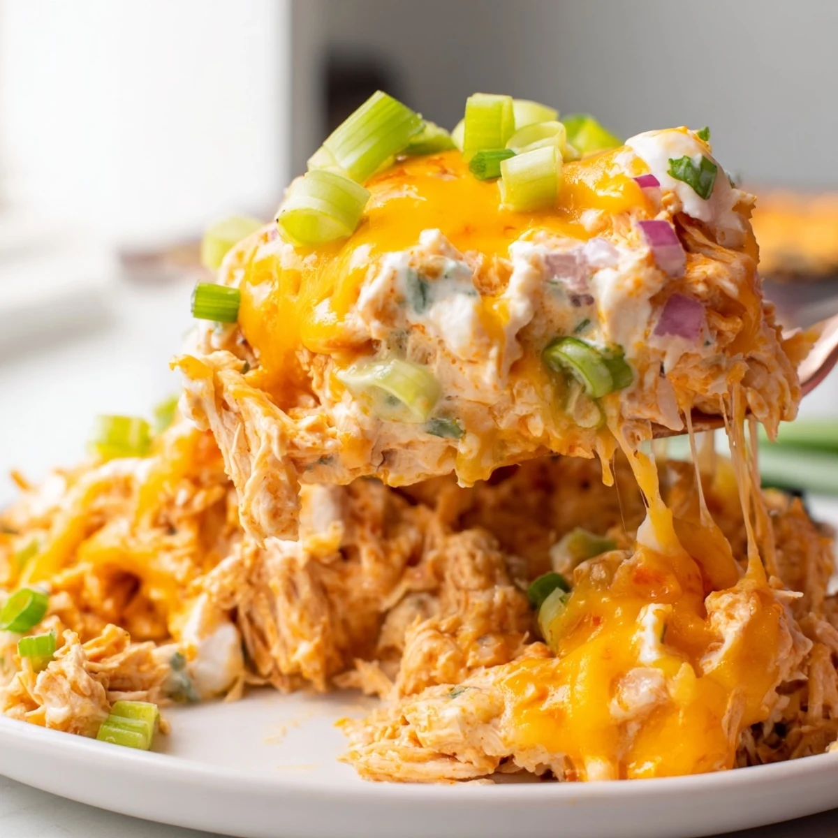 Bubbly jalapeño buffalo chicken casserole with golden melted cheddar fresh from oven