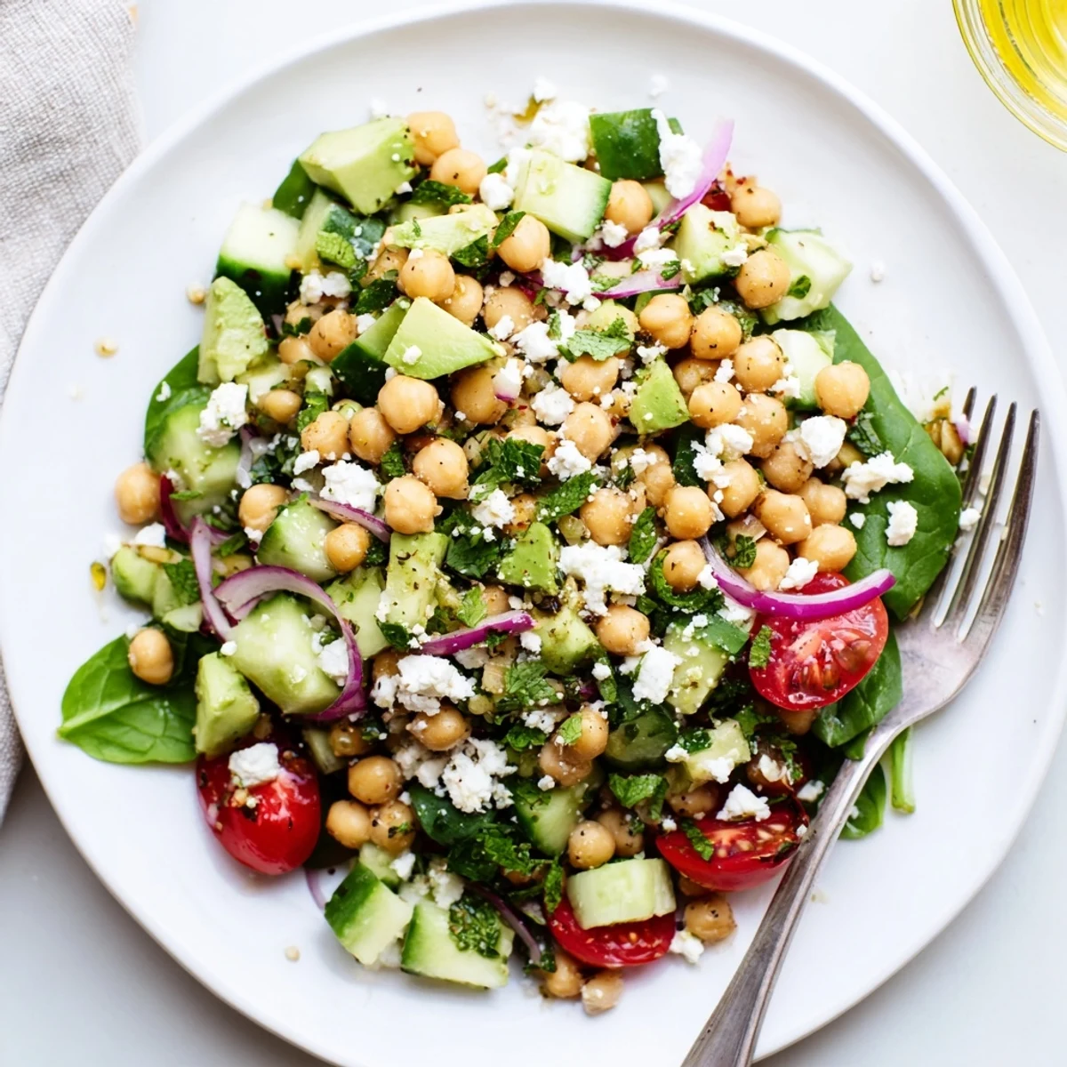 Chickpea Feta Avocado Salad topped with crumbled feta and fresh parsley