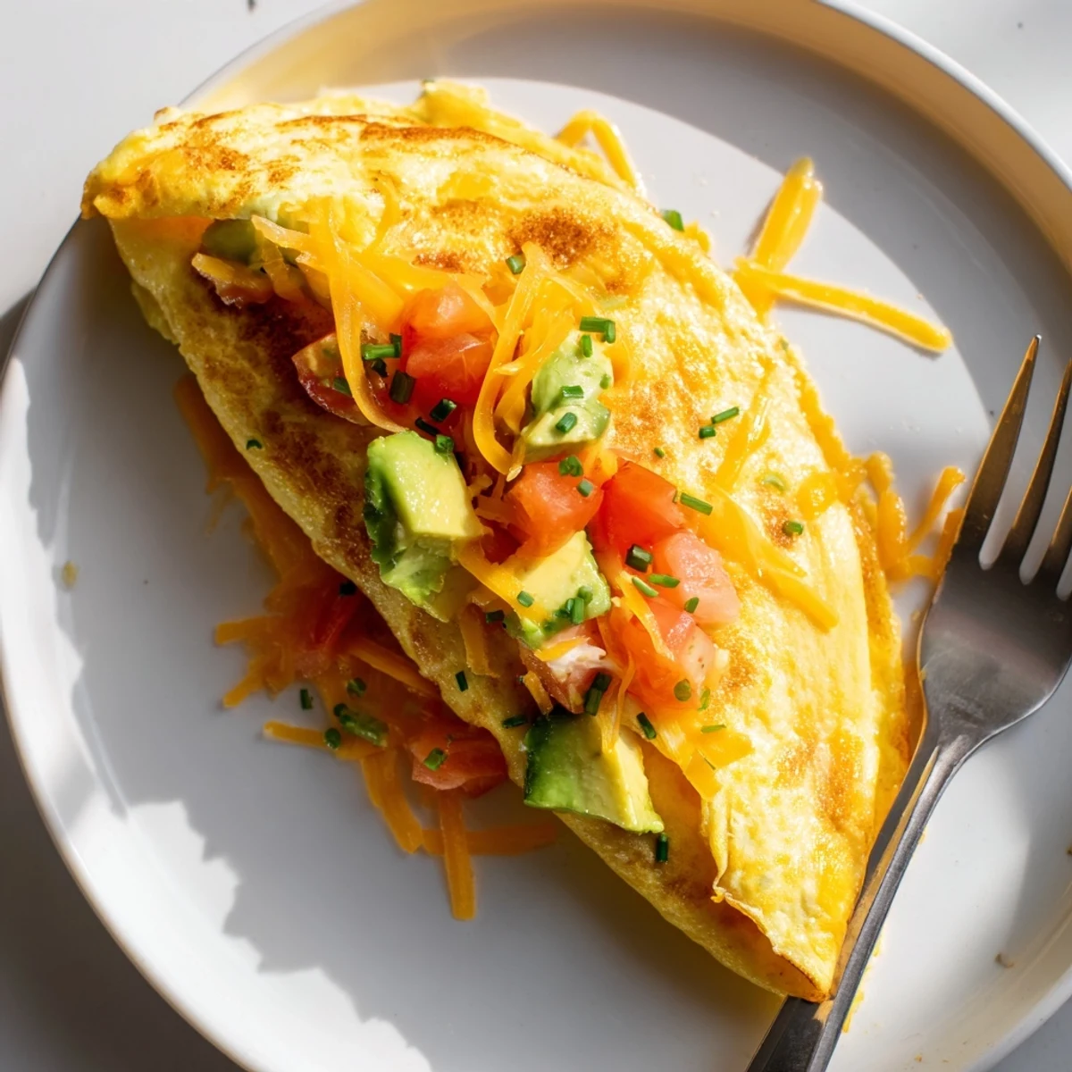 Creamy Avocado Cheese Tomato Omelette