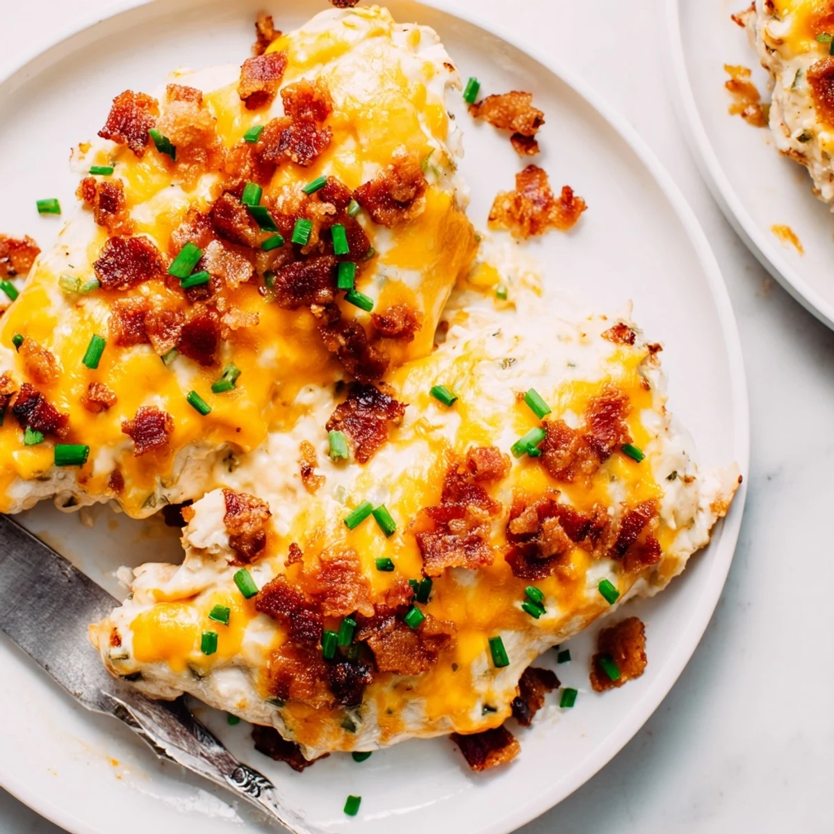 Golden baked crack chicken with bubbling cheddar cheese and crispy bacon topping