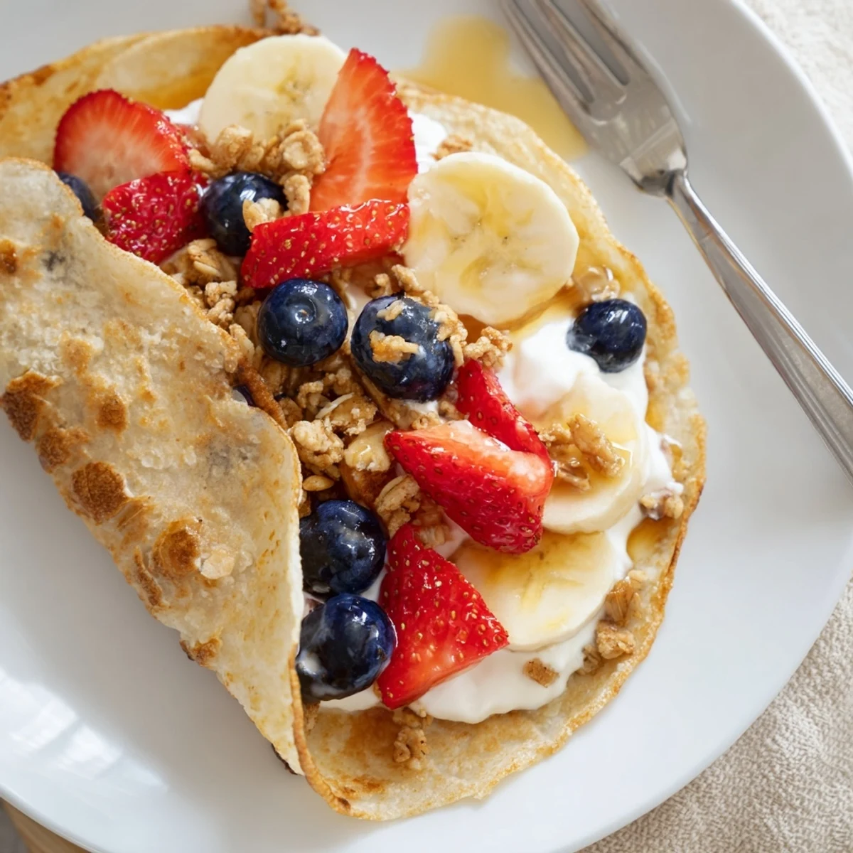 Fluffy pancake tacos stuffed with fresh berries and drizzled maple syrup. Golden pancake tacos folded and filled with scrambled eggs and bacon. Warm pancake tacos overflowing with Greek yogurt and crunchy granola.