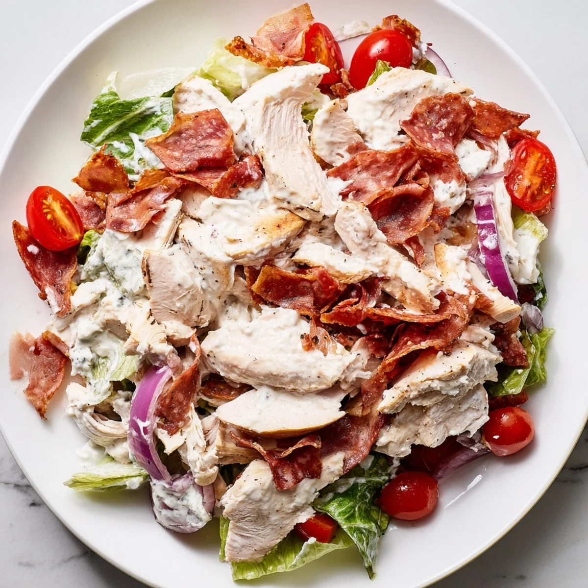 Zesty Italian grinder chicken salad topped with provolone and creamy dressing.