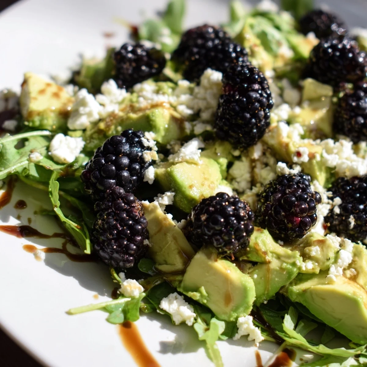 Fresh blackberry avocado salad with creamy avocado, peppery arugula, and zesty honey-lime dressing  