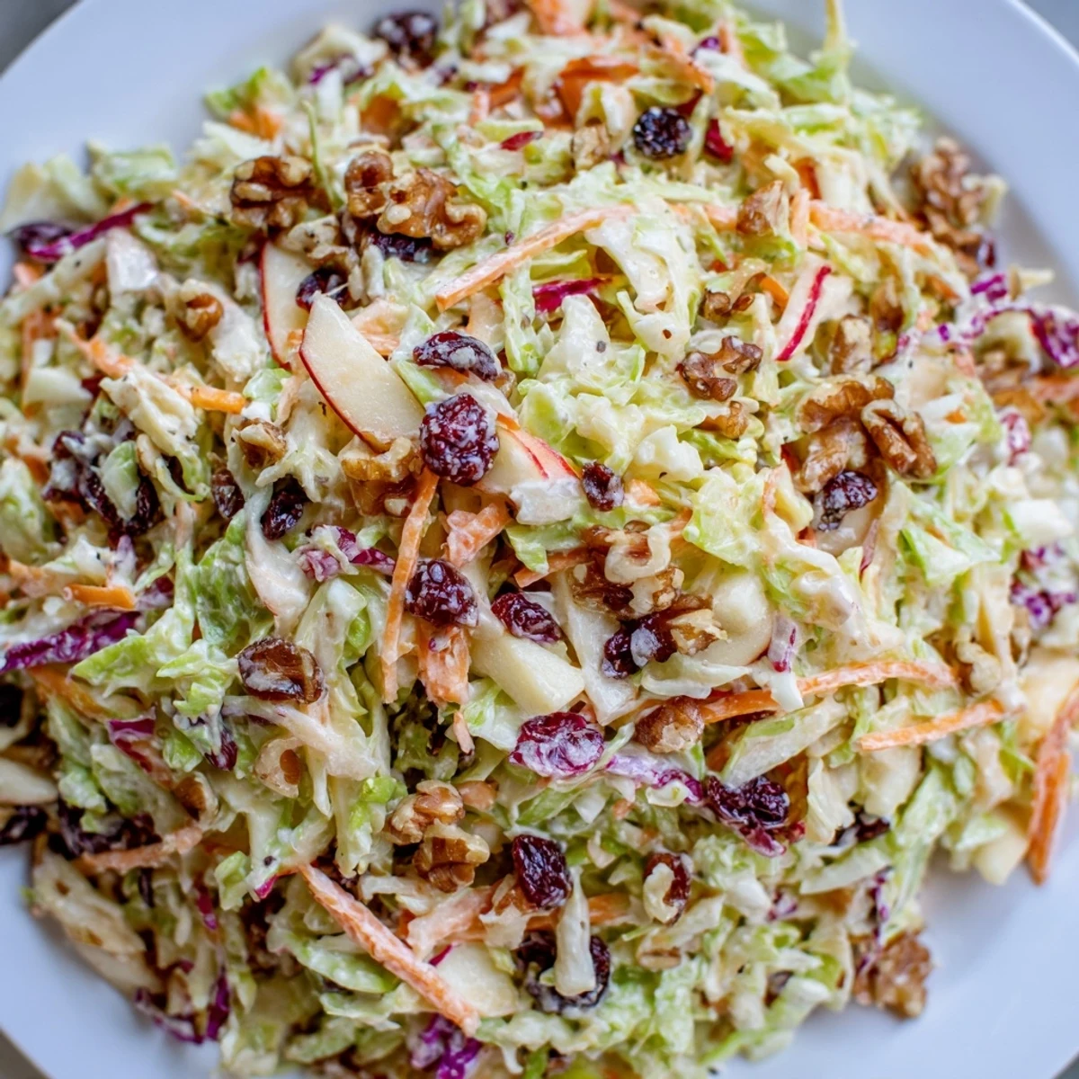 Close-up of vibrant Cranberry Apple Coleslaw, a refreshing side dish for gatherings.