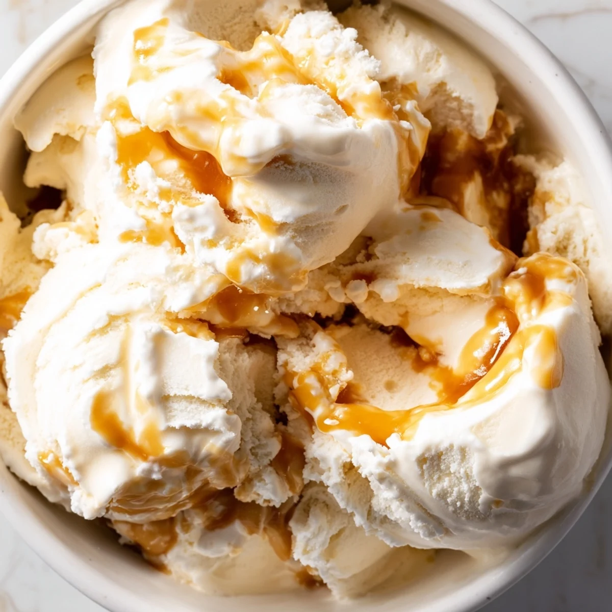 Creamy no churn salted caramel ice cream topped with golden caramel swirls.  