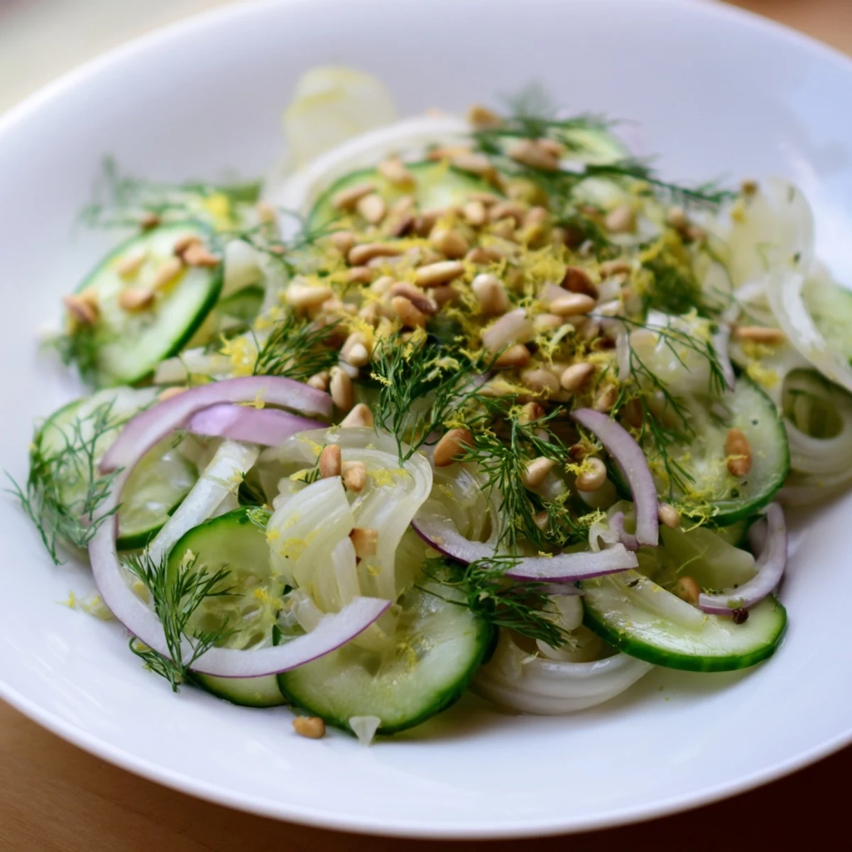 Crisp Fennel Cucumber Salad topped with fresh dill and zesty citrus dressing.